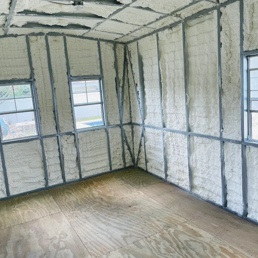 Closed-cell spray foam insulation applied to wall cavities in a residential project in Rawlins